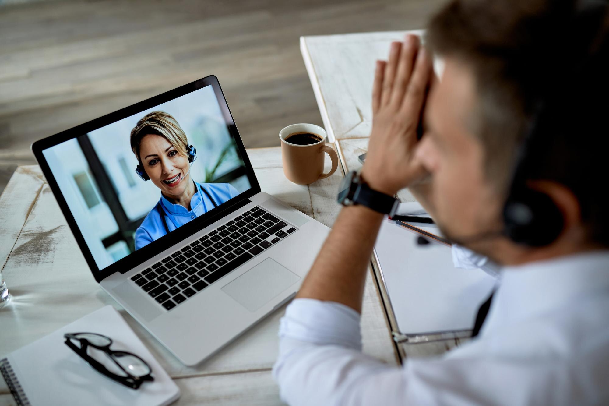 Telemedicine clinical consultant helping remote client