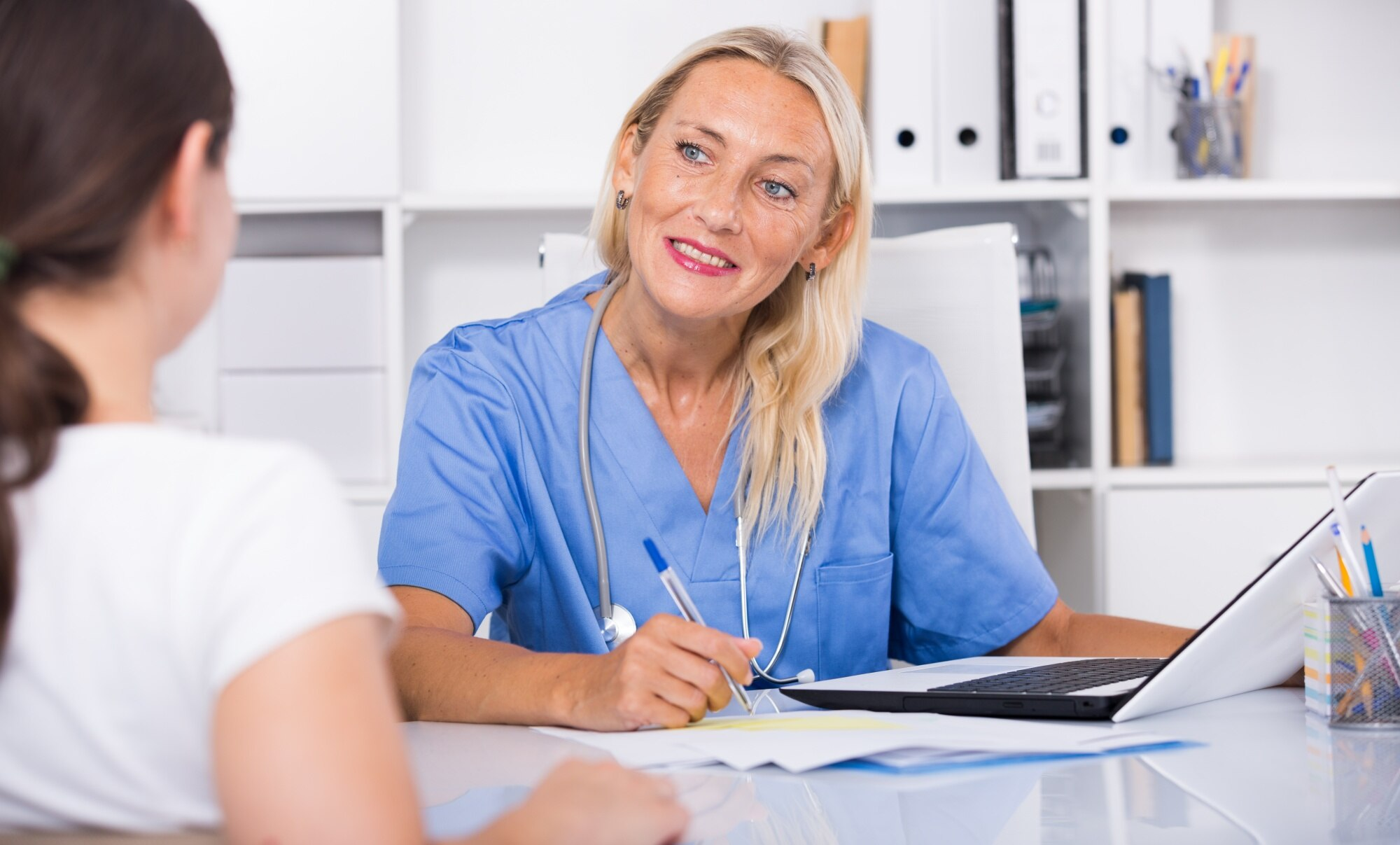 Volunteer doctor explaining treatment options